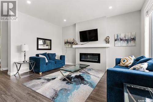 4037 Delhaye Way, Regina, SK - Indoor Photo Showing Living Room With Fireplace