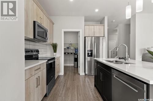 4037 Delhaye Way, Regina, SK - Indoor Photo Showing Kitchen With Double Sink With Upgraded Kitchen