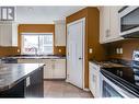 7587 Creekside Way, Prince George, BC  - Indoor Photo Showing Kitchen With Double Sink 