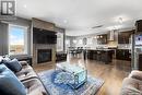 5577 Norseman Crescent, Regina, SK  - Indoor Photo Showing Living Room With Fireplace 