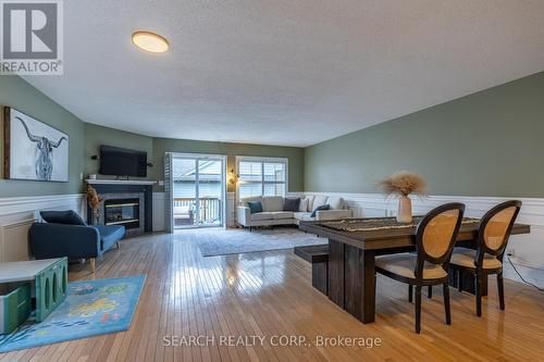 #4 -263 Plains Rd W, Burlington, ON - Indoor Photo Showing Living Room With Fireplace