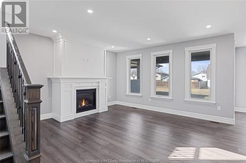 19 Belleview Drive, Cottam, ON - Indoor Photo Showing Living Room With Fireplace