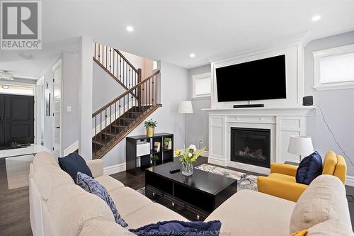 23 Belleview Drive, Cottam, ON - Indoor Photo Showing Living Room With Fireplace
