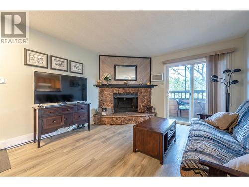286 Green Ave W Avenue Unit# 102, Penticton, BC - Indoor Photo Showing Living Room With Fireplace