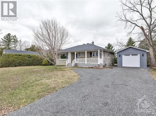 Great curb appeal with newly built garage. Parking for several vehicles. - 5961 Perth Street, Ottawa, ON - Outdoor
