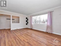 Living room with laminate hardwood floors - 