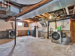 Full height basement with laundry and water treatment system - 