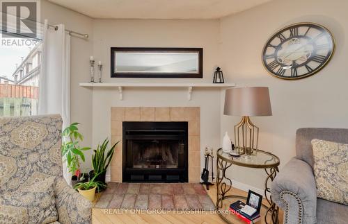 #38 -2200 Glenwood School Dr, Burlington, ON - Indoor Photo Showing Living Room With Fireplace