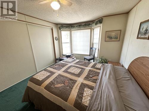 11 208 8Th Street, 100 Mile House, BC - Indoor Photo Showing Bedroom