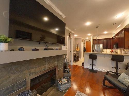 213-1325 Bear Mountain Pkwy, Langford, BC - Indoor With Fireplace