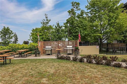 Summer view of community BBQ area - 301 Frances Avenue|Unit #203, Stoney Creek, ON - Outdoor