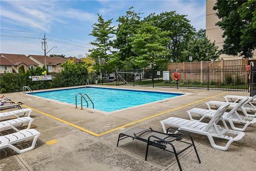 Summer view of community pool - 301 Frances Avenue|Unit #203, Stoney Creek, ON - Outdoor With In Ground Pool