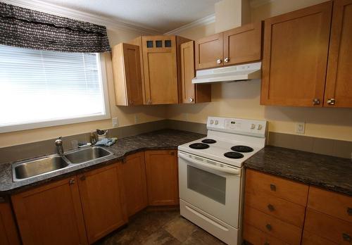 505 3A Avenue, Nakusp, BC - Indoor Photo Showing Kitchen With Double Sink