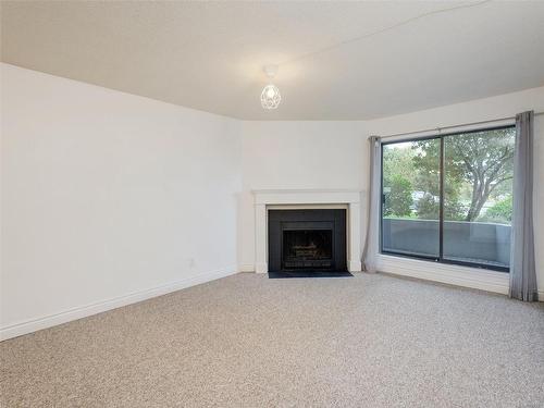 101-1655 Begbie St, Victoria, BC - Indoor Photo Showing Living Room With Fireplace