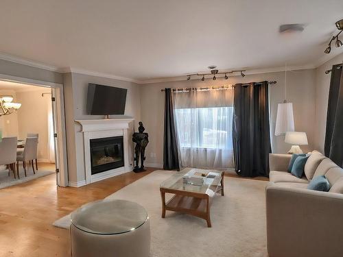 Salon - 104-39 37E Avenue E., Blainville, QC - Indoor Photo Showing Living Room With Fireplace