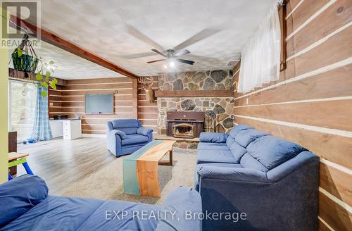 97 Wellington Street N, Mapleton, ON - Indoor Photo Showing Living Room With Fireplace