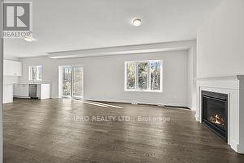 59 Tulip Cres, Norfolk, ON - Indoor Photo Showing Living Room With Fireplace