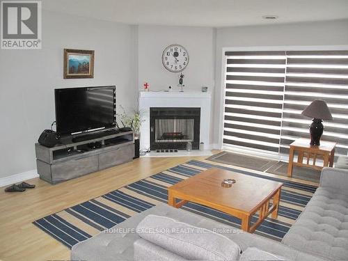 21 - 100 Laguna Parkway, Ramara, ON - Indoor Photo Showing Living Room With Fireplace
