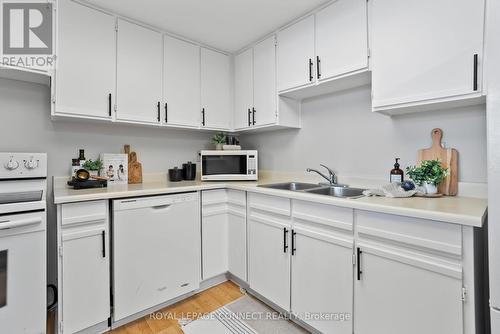 #516 -20 Dean Park Rd, Toronto, ON - Indoor Photo Showing Kitchen With Double Sink
