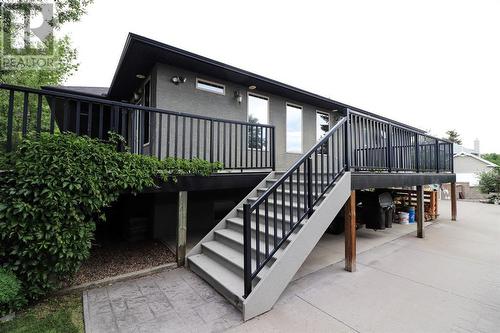 Looking up to the deck area from the patio - 52 Greystone Close E, Brooks, AB - Outdoor With Deck Patio Veranda With Exterior