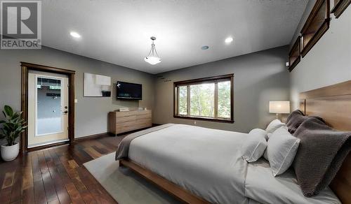 Master Bedroom - Virtually Staged - 52 Greystone Close E, Brooks, AB - Indoor Photo Showing Bedroom