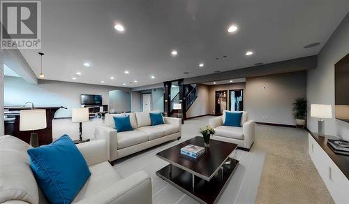 Basement Family/Games Room - Virtually Staged - 52 Greystone Close E, Brooks, AB - Indoor