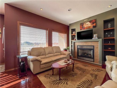 16 Plateau Drive, Brandon, MB - Indoor Photo Showing Living Room With Fireplace