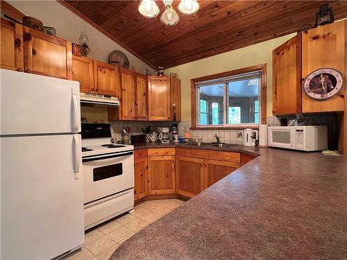 69 South Bay Drive, Onanole, MB - Indoor Photo Showing Kitchen With Double Sink