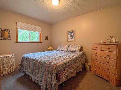 69 South Bay Drive, Onanole, MB - Indoor Photo Showing Bedroom