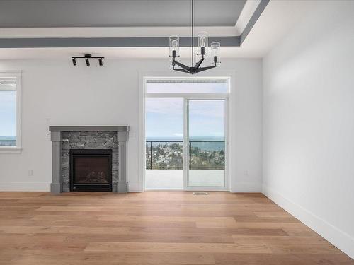 4684 Ambience Dr, Nanaimo, BC - Indoor Photo Showing Living Room With Fireplace