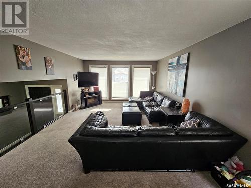 204 First Street, Carlyle, SK - Indoor Photo Showing Living Room With Fireplace
