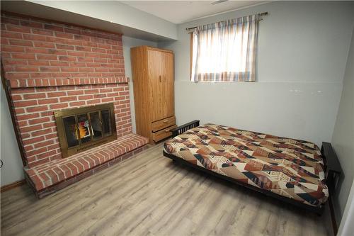 Bedr 2 - Bsmt - 96 Gillin Road, Brantford, ON - Indoor Photo Showing Bedroom With Fireplace