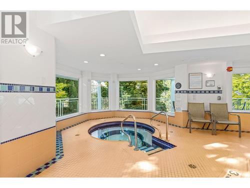 4520 Gallaghers Lookout Unit# 6, Kelowna, BC - Indoor Photo Showing Other Room With In Ground Pool