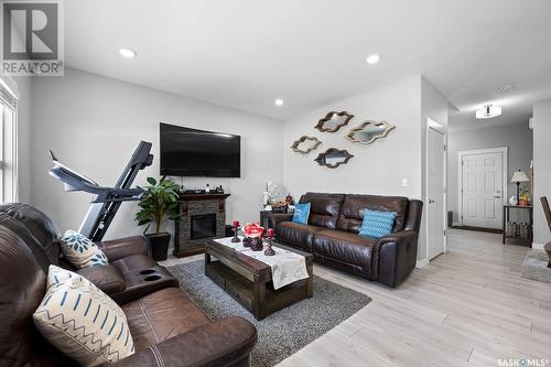 3451 Green Turtle Road, Regina, SK - Indoor Photo Showing Living Room With Fireplace