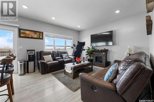 3451 Green Turtle Road, Regina, SK - Indoor Photo Showing Living Room With Fireplace