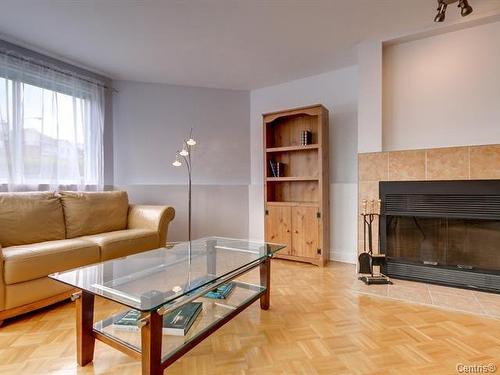 Salon - S102-1511 Boul. Shevchenko, Montréal (Lasalle), QC - Indoor Photo Showing Living Room With Fireplace