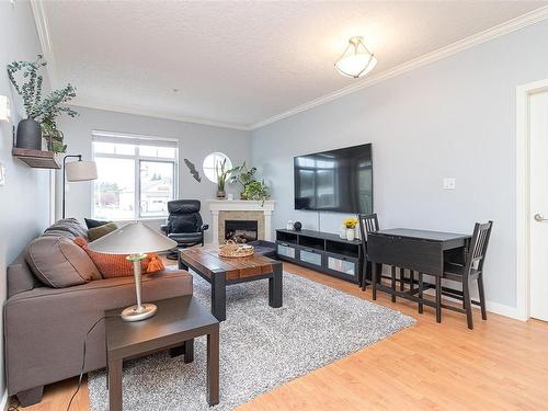 206-7088 West Saanich Rd, Central Saanich, BC - Indoor Photo Showing Living Room With Fireplace