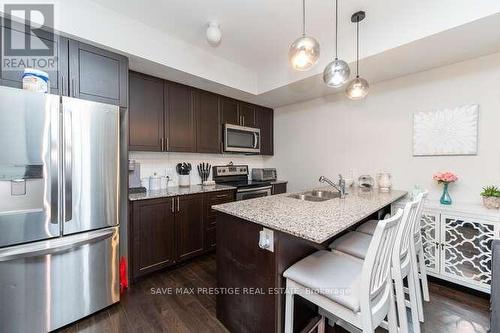 #101 -1204 Main St E, Milton, ON - Indoor Photo Showing Kitchen With Double Sink