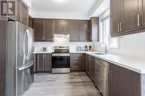 #62 -61 Soho St, Hamilton, ON - Indoor Photo Showing Kitchen With Double Sink
