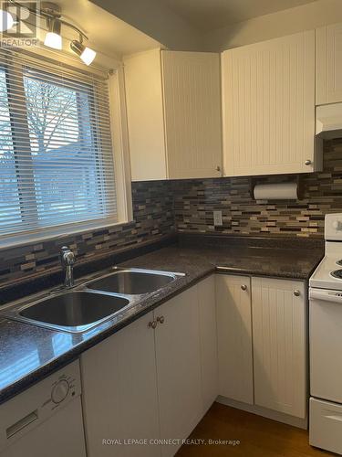#Main -375 Lawson Rd, Toronto, ON - Indoor Photo Showing Kitchen With Double Sink