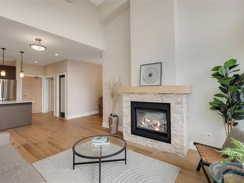 402-2850 Aldwynd Rd, Langford, BC - Indoor Photo Showing Living Room With Fireplace