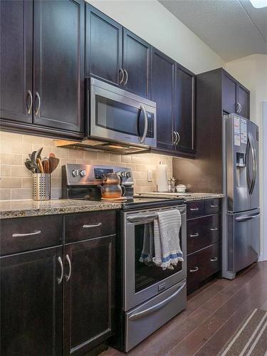 114 110 Creek Bend Road, Winnipeg, MB - Indoor Photo Showing Kitchen With Stainless Steel Kitchen