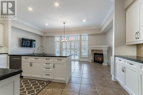 #24 -58 St Lawrence Dr, Mississauga, ON - Indoor Photo Showing Kitchen With Fireplace