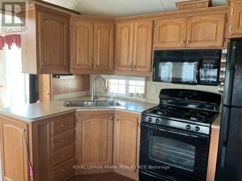 7 Mcgregor Drive S, Otonabee-South Monaghan, ON - Indoor Photo Showing Kitchen With Double Sink