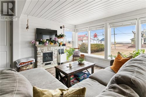 29 Sur L'Ocean St, Grand-Barachois, NB - Indoor Photo Showing Living Room With Fireplace
