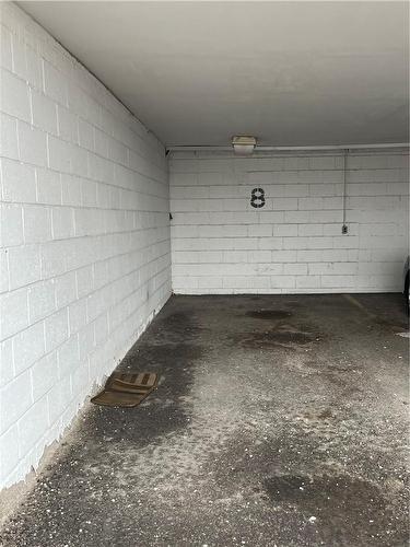 Parking Space #8 - 293 Mohawk Road E|Unit #702, Hamilton, ON - Indoor Photo Showing Garage