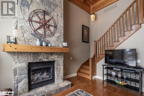 3876 Muskoka Road 118 W Unit# Carling 10-W3, Port Carling, ON - Indoor Photo Showing Living Room With Fireplace