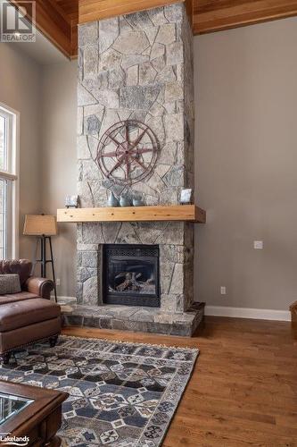 3876 Muskoka Road 118 W Unit# Carling 10-W3, Port Carling, ON - Indoor Photo Showing Living Room With Fireplace