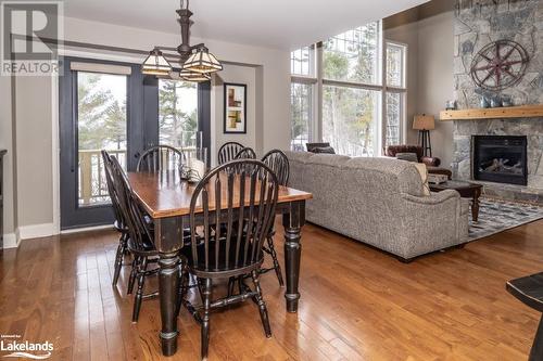 3876 Muskoka Road 118 W Unit# Carling 10-W3, Port Carling, ON - Indoor Photo Showing Dining Room With Fireplace