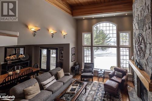 3876 Muskoka Road 118 W Unit# Carling 10-W3, Port Carling, ON - Indoor Photo Showing Living Room With Fireplace